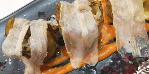 Alcachofa confitada en AOVE con velo ibérico